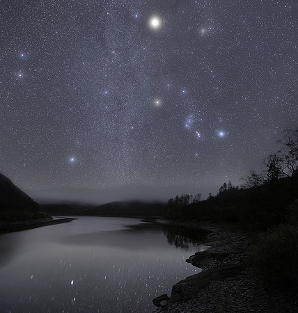 A misty night sky with Orion and Mars