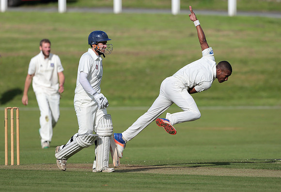 Dario Searle of Bollington bowls a fast ball